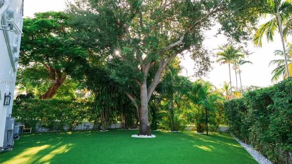 a view of a brick house with large windows