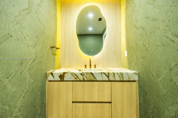 a spacious bathroom with a large tub shower and sink