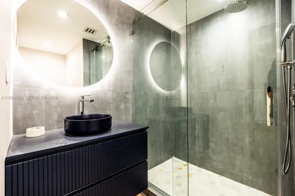 a view of a kitchen with a sink and dishwasher in it