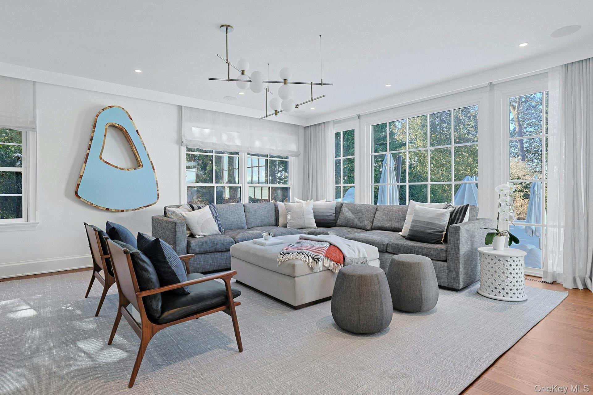 19 Overlook Road Scarsdale, NY 10583 - Photo 12 of 50 a living room with furniture a large window and a chandelier