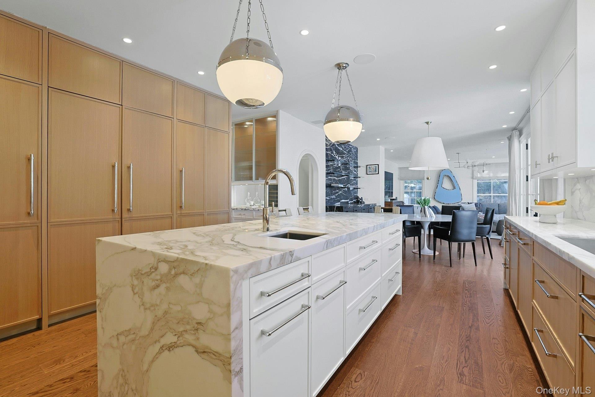 19 Overlook Road Scarsdale, NY 10583 - Photo 17 of 50 a large kitchen with kitchen island a large counter space a sink appliances and cabinets