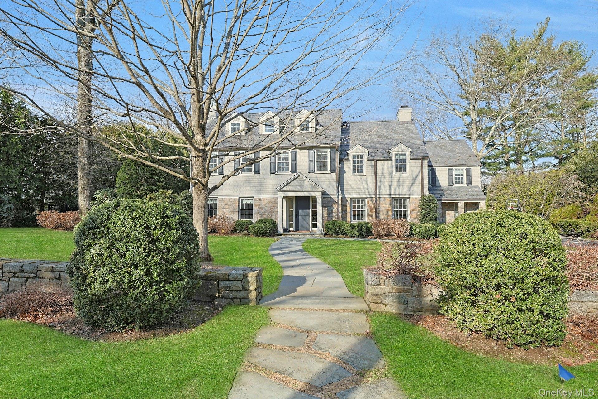 19 Overlook Road Scarsdale, NY 10583 - Photo 2 of 50 a front view of a house with a yard