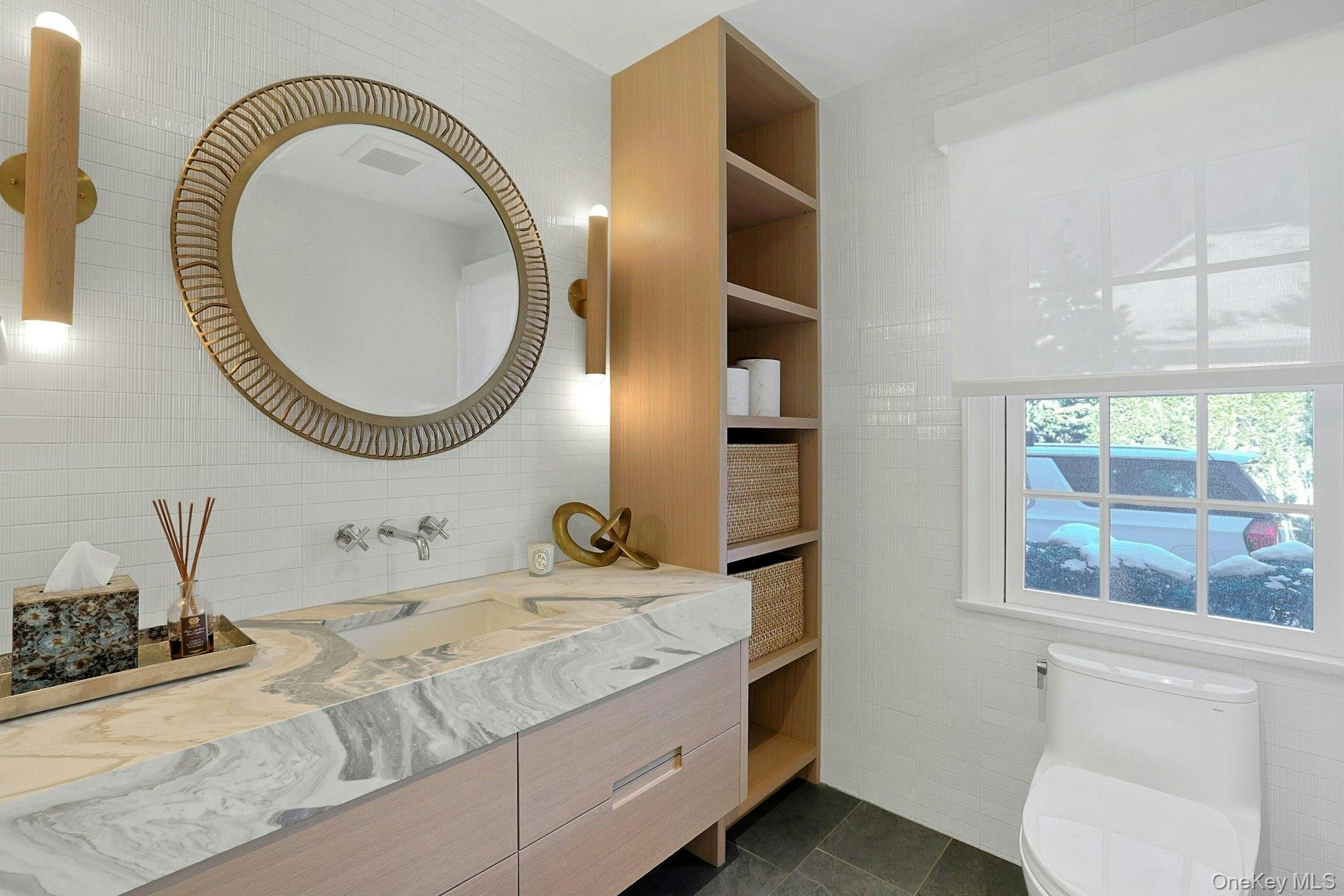 19 Overlook Road Scarsdale, NY 10583 - Photo 24 of 50 a bathroom with a granite countertop sink and a mirror