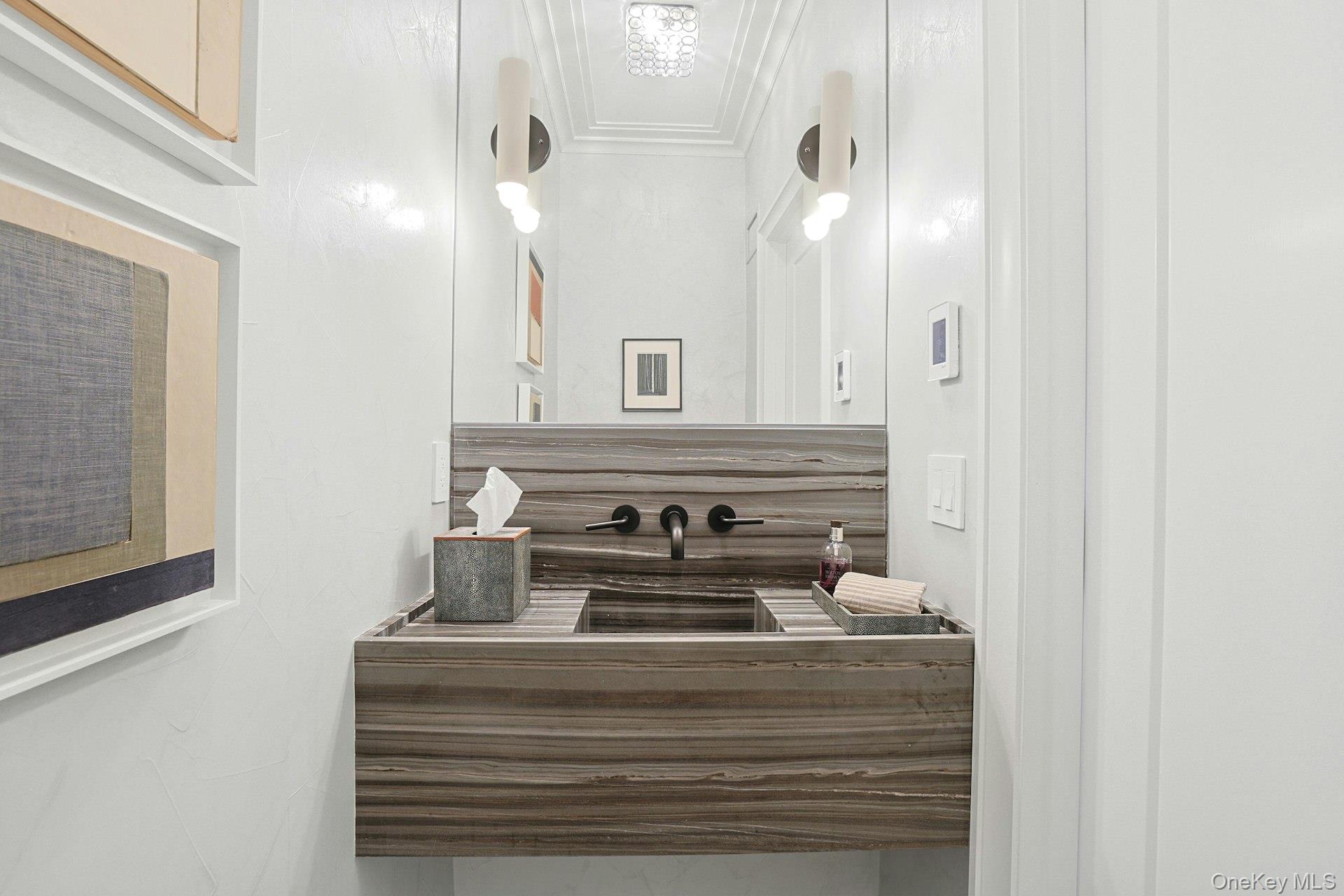 19 Overlook Road Scarsdale, NY 10583 - Photo 25 of 50 a bathroom with a sink and a mirror