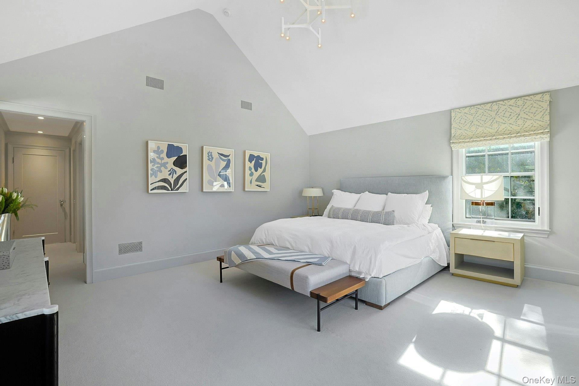 19 Overlook Road Scarsdale, NY 10583 - Photo 27 of 50 a spacious bedroom with a bed and a table in it