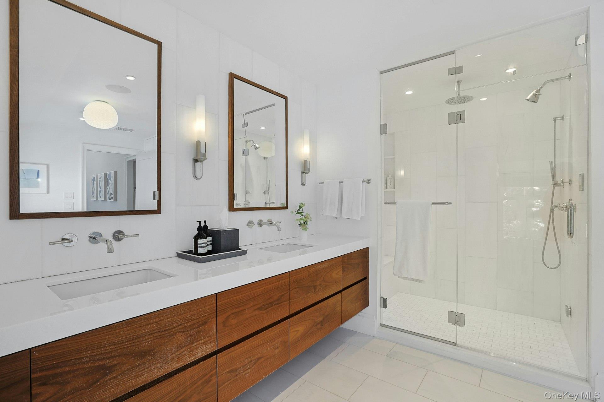 19 Overlook Road Scarsdale, NY 10583 - Photo 30 of 50 a bathroom with a double vanity sink mirror and shower