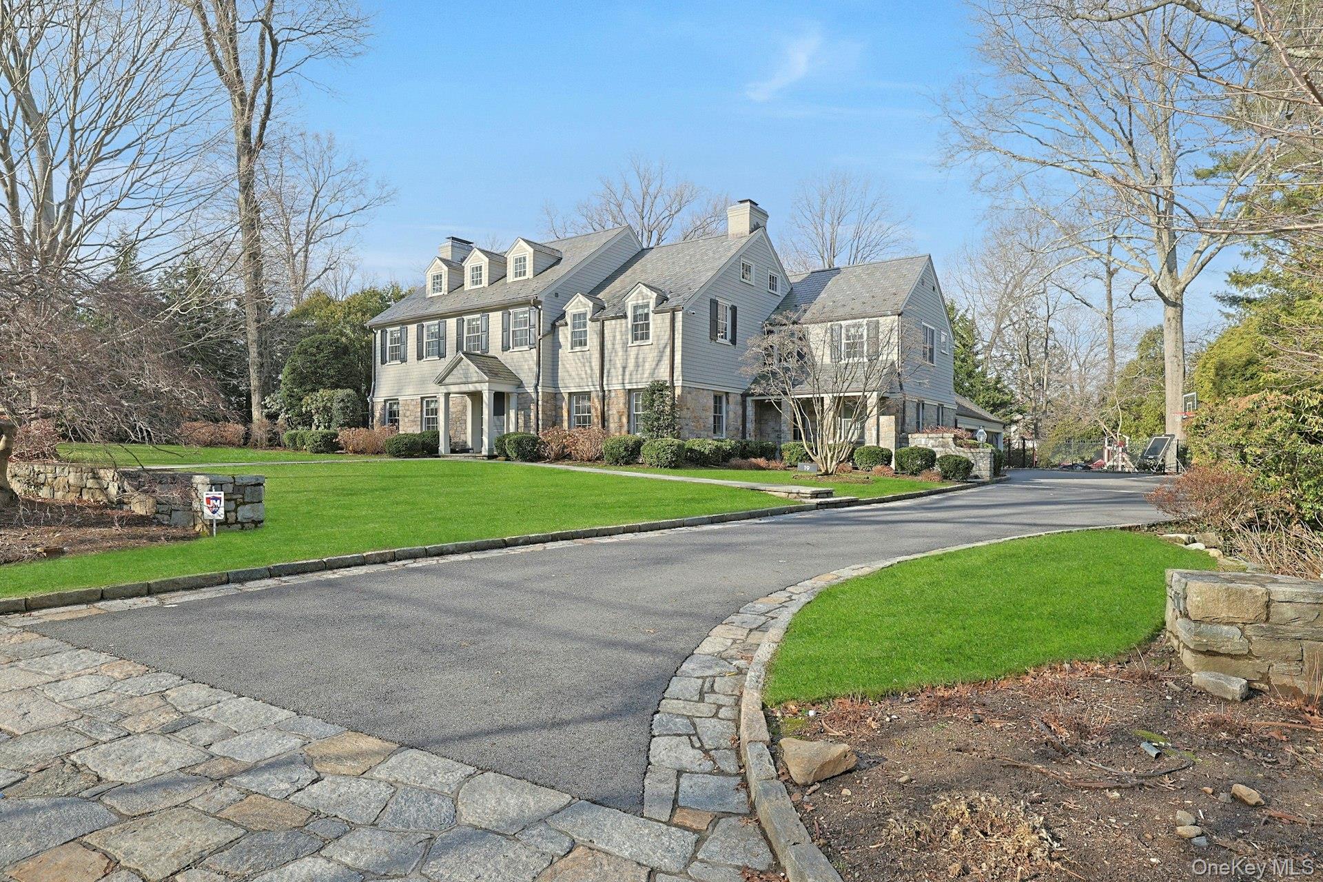 19 Overlook Road Scarsdale, NY 10583 - Photo 3 of 50 a view of a big house with a big yard and large trees