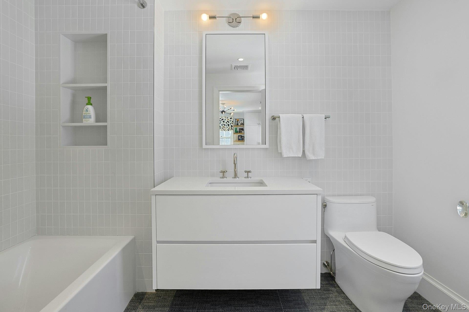 19 Overlook Road Scarsdale, NY 10583 - Photo 32 of 50 a bathroom with a sink toilet and vanity