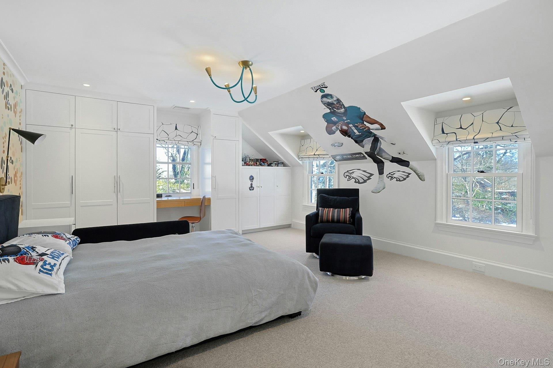 19 Overlook Road Scarsdale, NY 10583 - Photo 33 of 50 a bedroom with a bed and a chandelier
