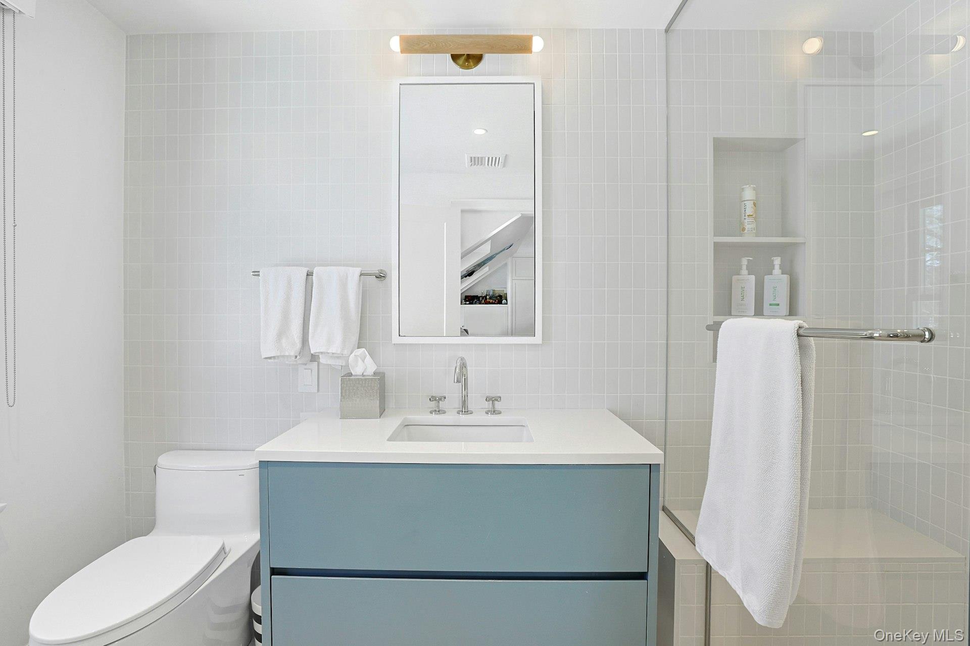 19 Overlook Road Scarsdale, NY 10583 - Photo 34 of 50 a bathroom with a sink vanity mirror and toilet