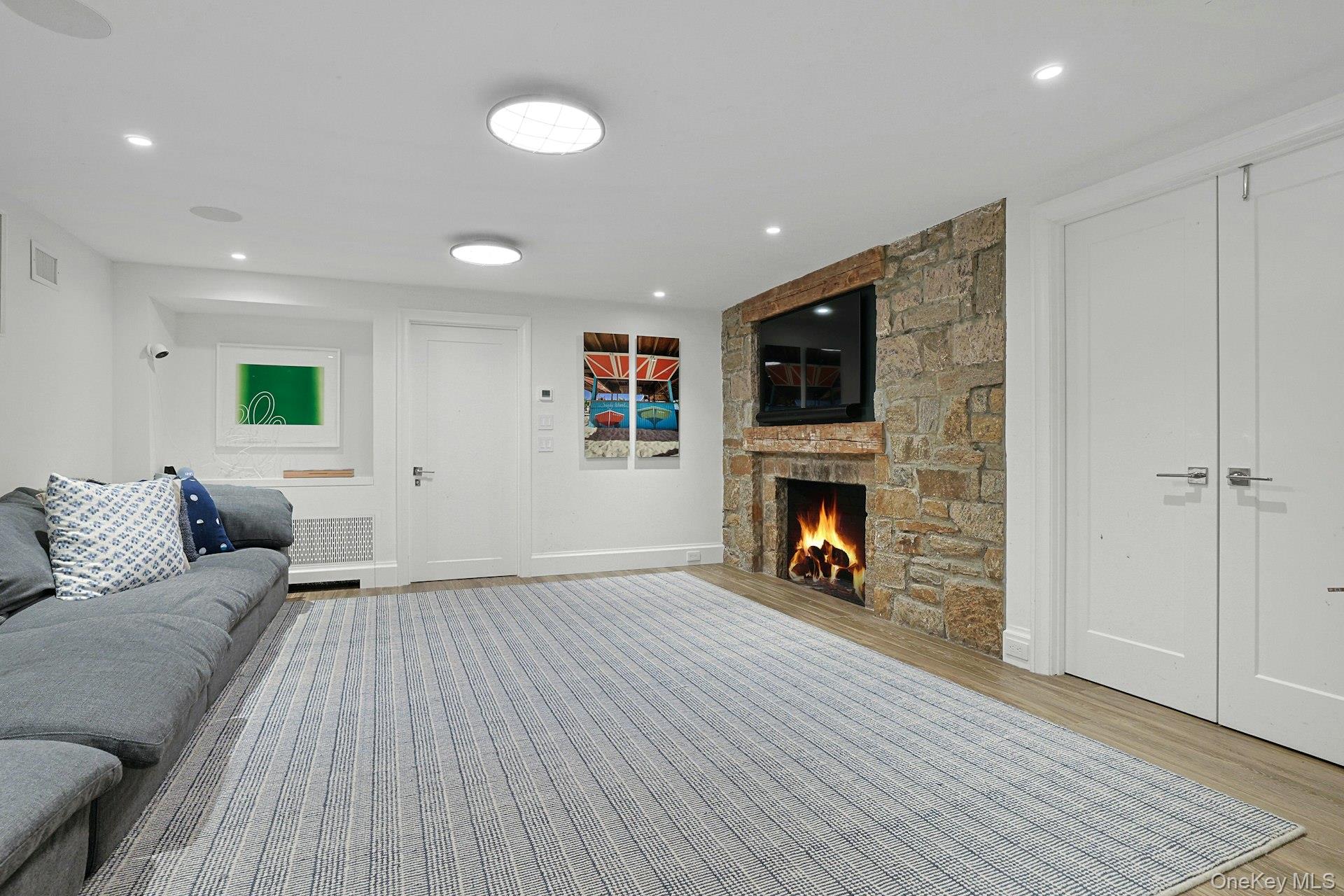 19 Overlook Road Scarsdale, NY 10583 - Photo 43 of 50 a living room with furniture and a fireplace