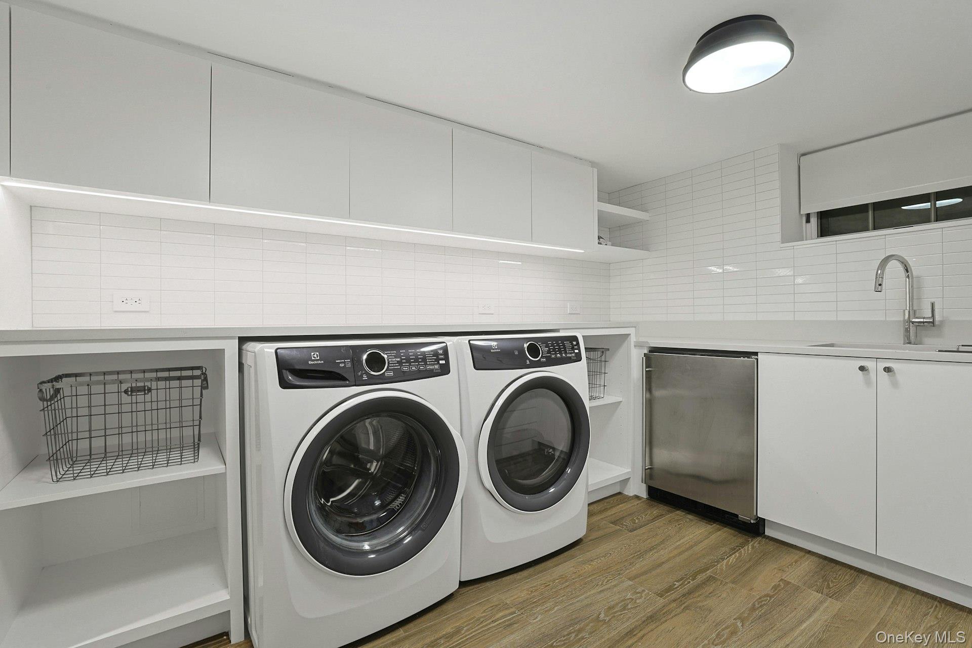 19 Overlook Road Scarsdale, NY 10583 - Photo 46 of 50 a utility room with sink dryer and washer