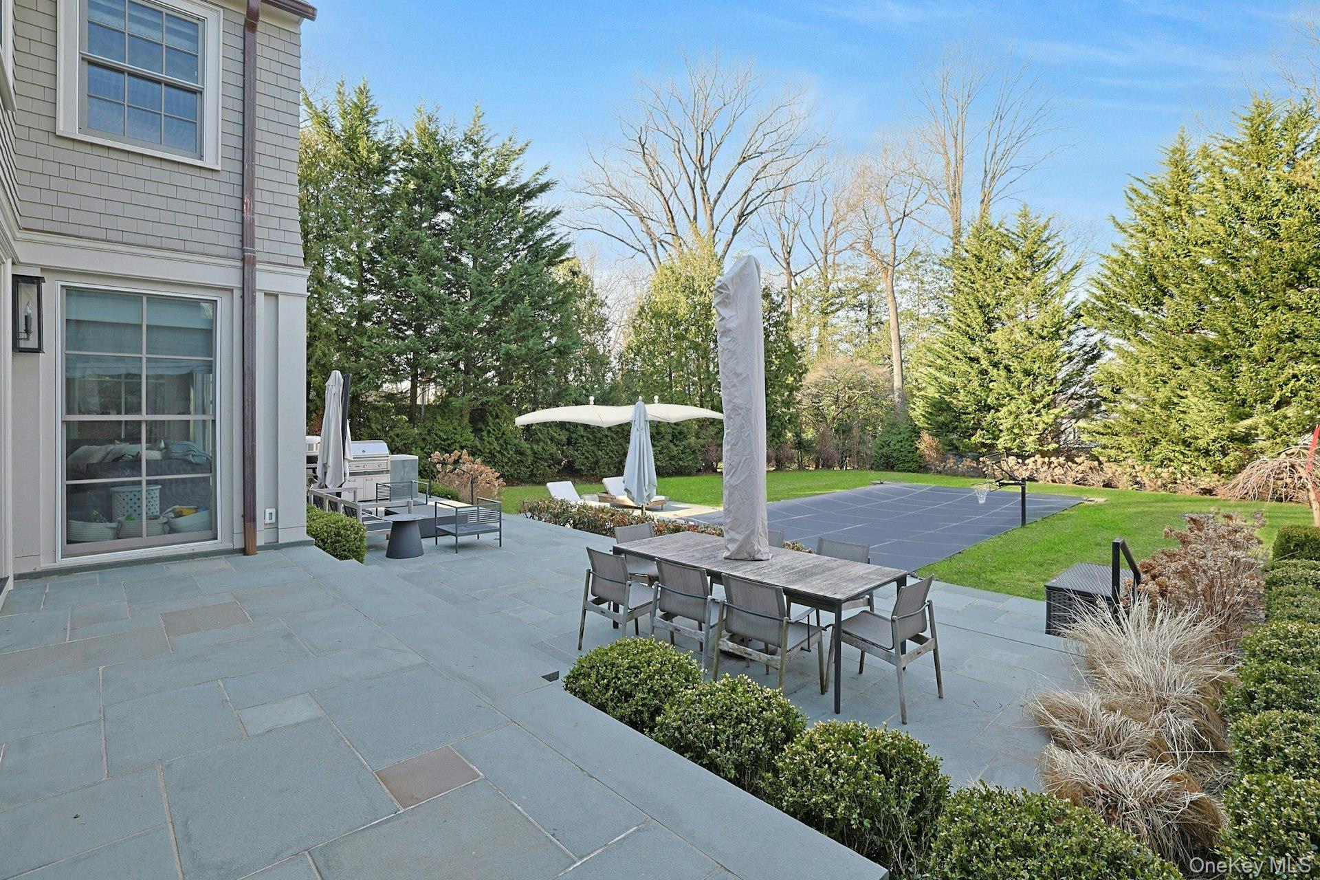 19 Overlook Road Scarsdale, NY 10583 - Photo 47 of 50 a view of a backyard with plants and a patio