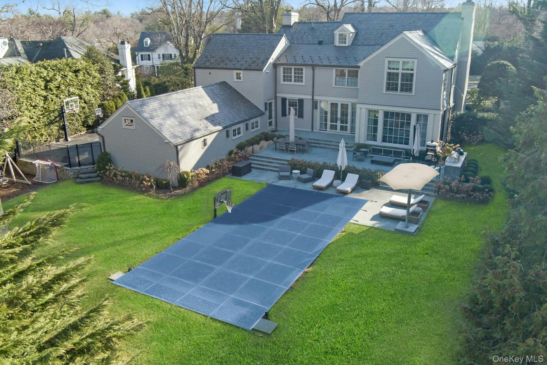 19 Overlook Road Scarsdale, NY 10583 - Photo 49 of 50 a aerial view of a house with a yard and sitting area