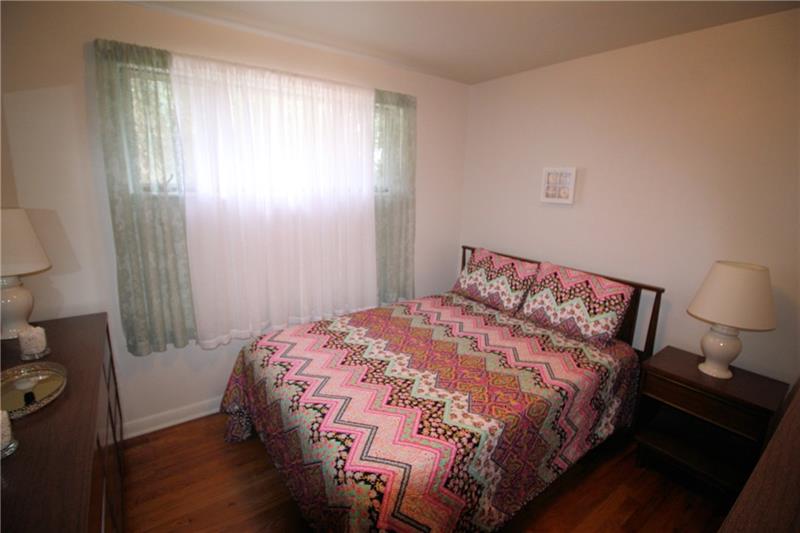 331 Livingston Road West Mifflin, PA 15122 - Photo 12 of 20 Second bedroom has exposed hardwood floors.