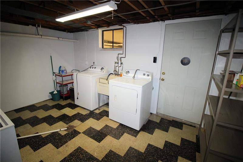 331 Livingston Road West Mifflin, PA 15122 - Photo 17 of 20 Separate laundry room off the game room. The washer and dryer are included.