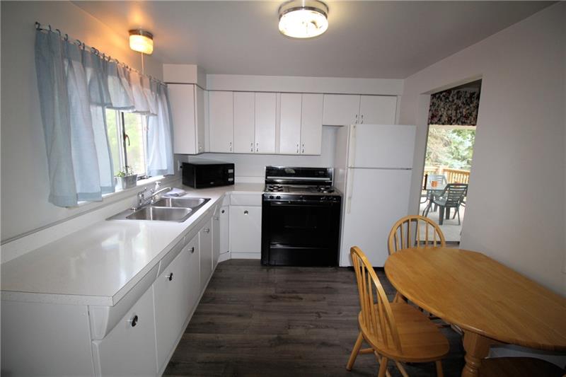 331 Livingston Road West Mifflin, PA 15122 - Photo 5 of 20 "Retro" style kitchen with refinished cabinets and newer flooring.