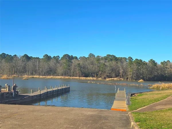 a view of a lake with houses in the back
