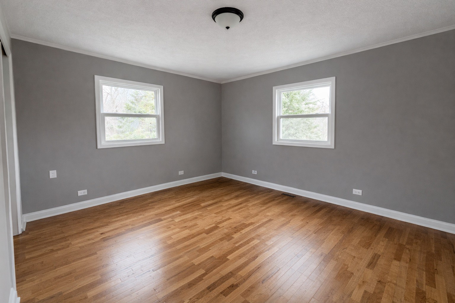 109 Apple Tree Street Arlington, KY 42021 - Photo 13 of 18 a view of an empty room with wooden floor and a window