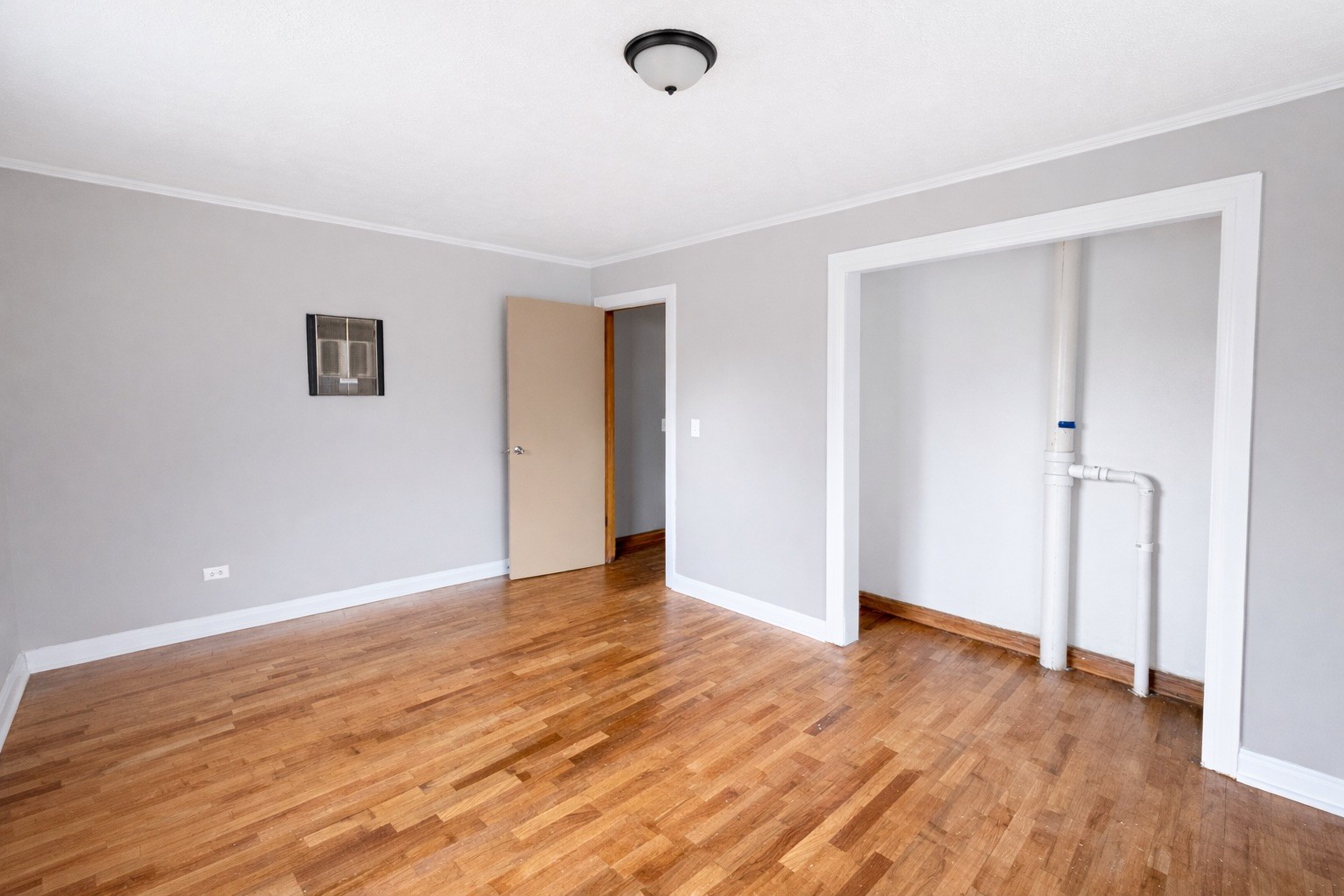 109 Apple Tree Street Arlington, KY 42021 - Photo 14 of 18 an empty room with wooden floor and windows