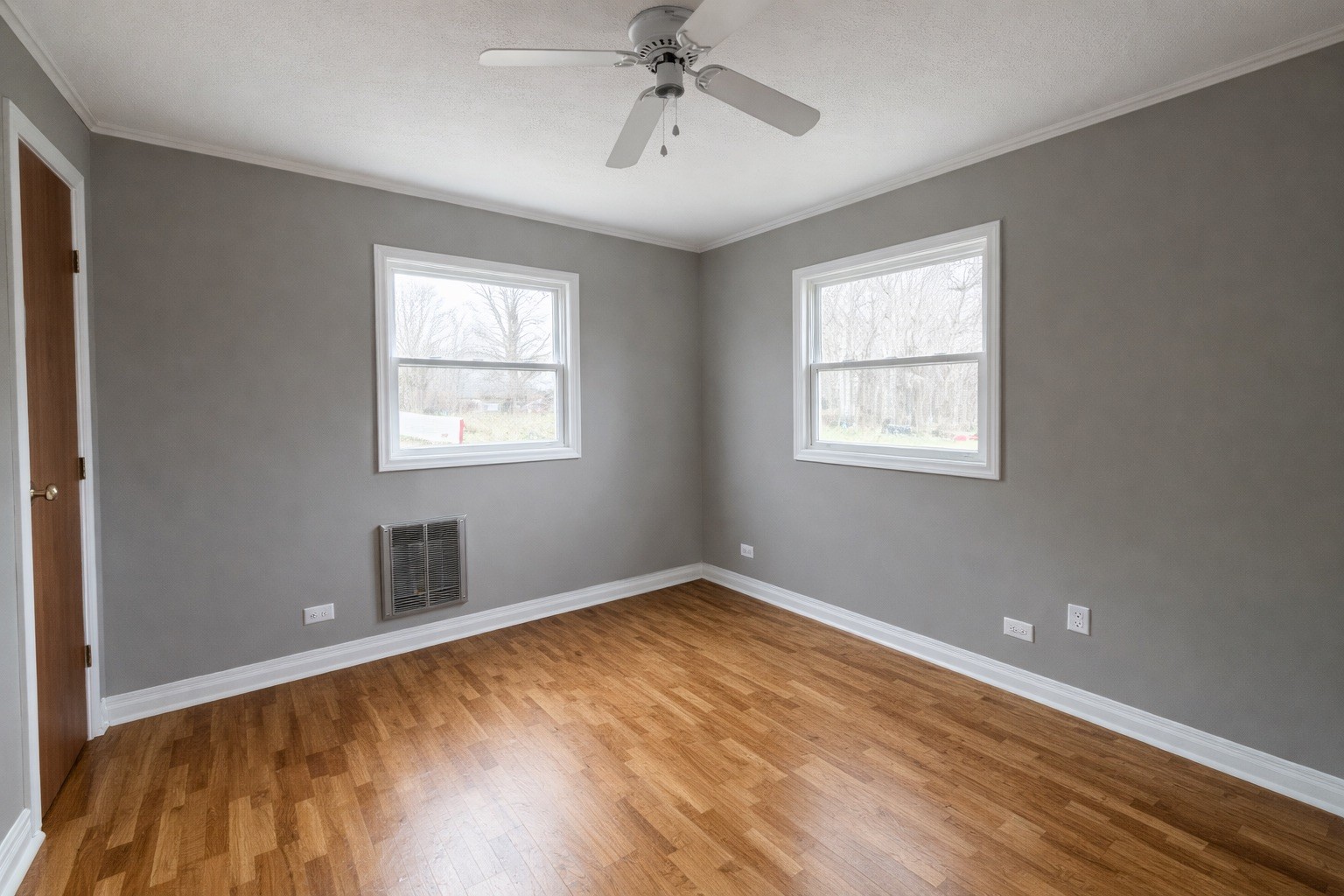 109 Apple Tree Street Arlington, KY 42021 - Photo 9 of 18 a view of an empty room with wooden floor and a window