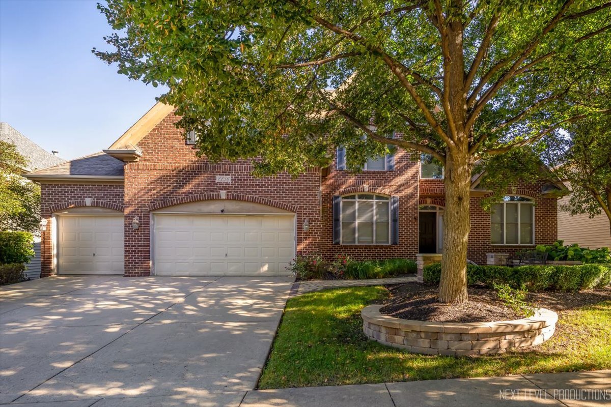 2236 Red Maple Lane Aurora, IL 60502 - Photo 1 of 50 a front view of a house with garden