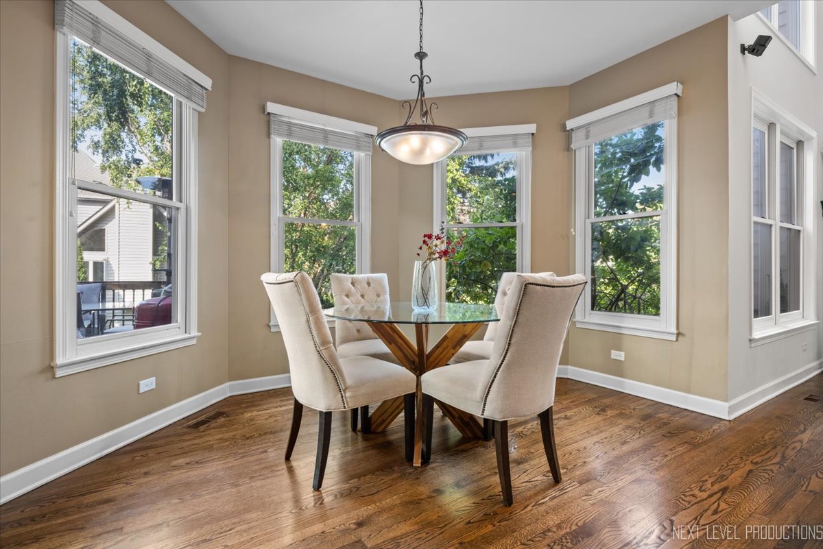 2236 Red Maple Lane Aurora, IL 60502 - Photo 19 of 50 a view of a dining room with furniture window and wooden floor