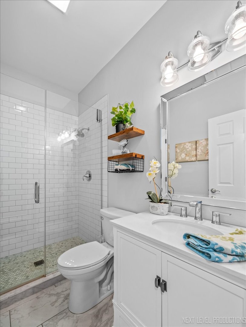 2236 Red Maple Lane Aurora, IL 60502 - Photo 21 of 50 a bathroom with a sink a toilet and shower