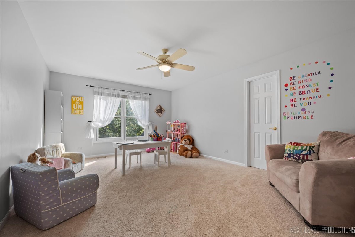 2236 Red Maple Lane Aurora, IL 60502 - Photo 27 of 50 a living room with furniture and a large window
