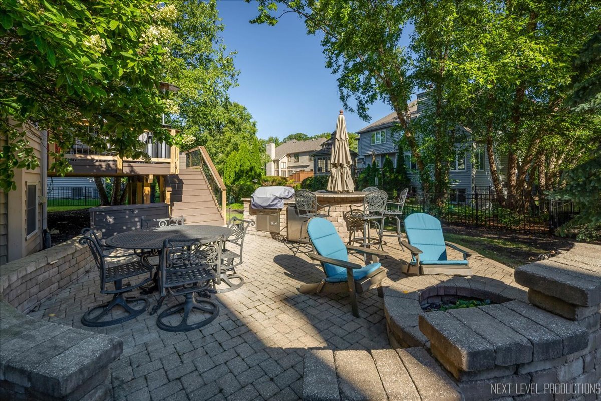 2236 Red Maple Lane Aurora, IL 60502 - Photo 40 of 50 a view of a patio with couches table and chairs and potted plants