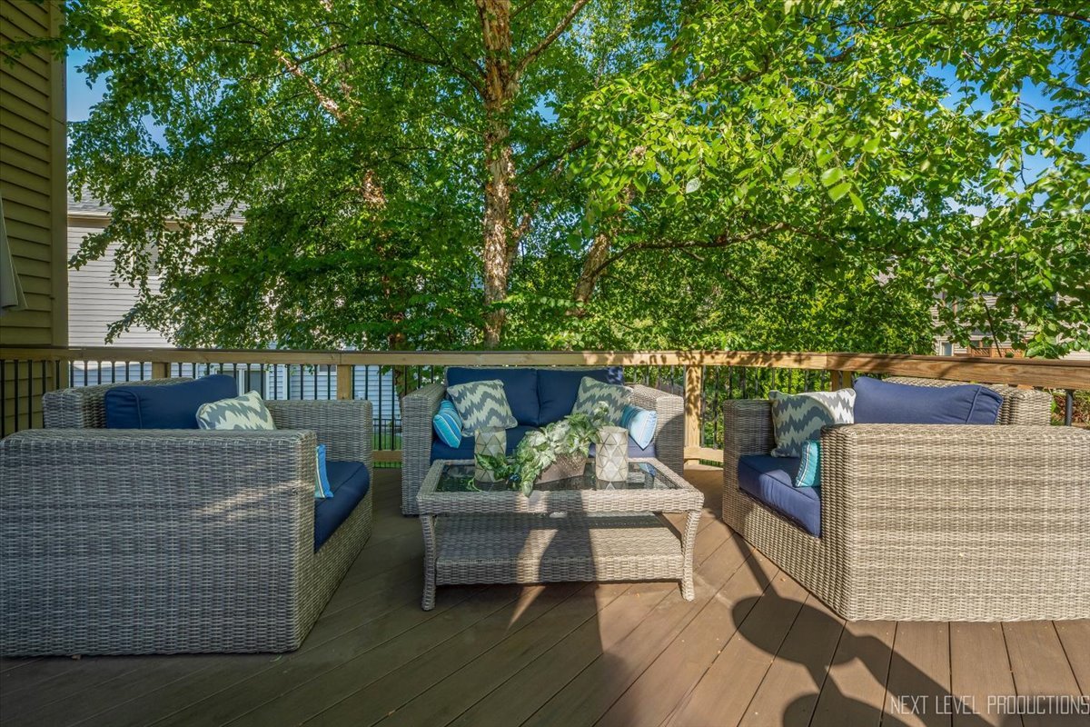 2236 Red Maple Lane Aurora, IL 60502 - Photo 42 of 50 a view of deck and deck with couches and wooden floor
