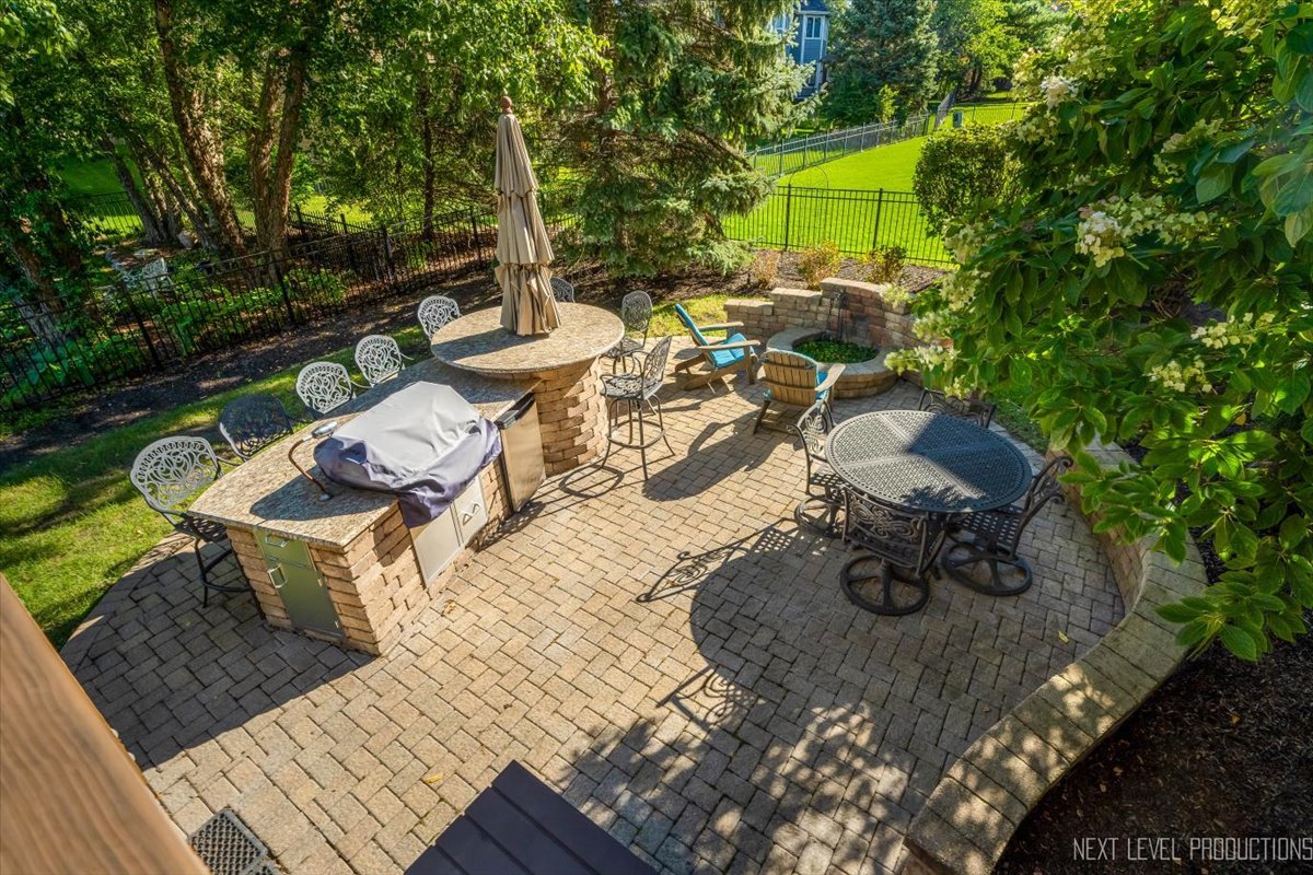 2236 Red Maple Lane Aurora, IL 60502 - Photo 43 of 50 a view of a chairs and table in backyard