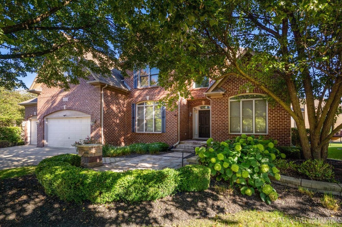 2236 Red Maple Lane Aurora, IL 60502 - Photo 46 of 50 a front view of a house with garden