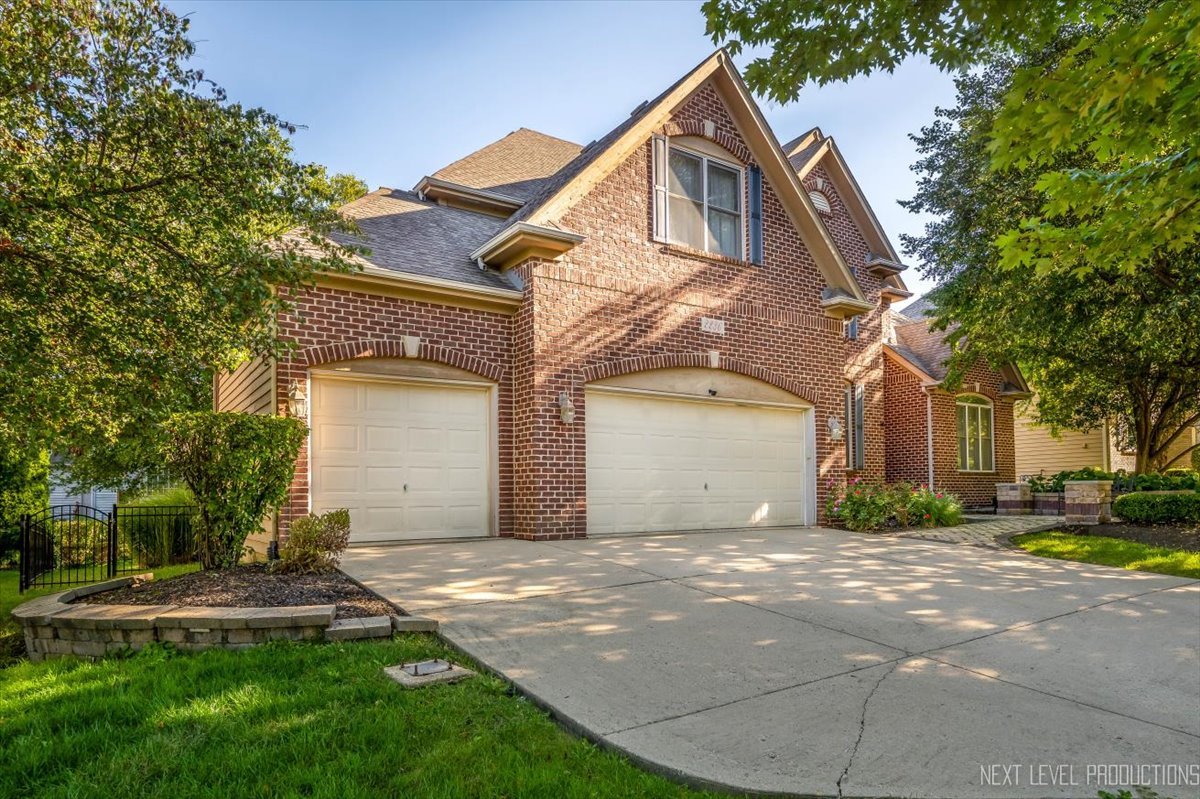 2236 Red Maple Lane Aurora, IL 60502 - Photo 47 of 50 a front view of a house with a yard and garage