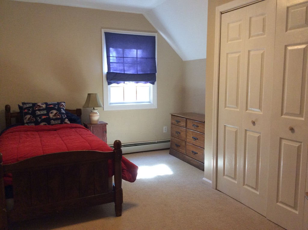 46 Old Village Road Sturbridge, MA 01566 - Photo 11 of 18 a bedroom with a bed and a window