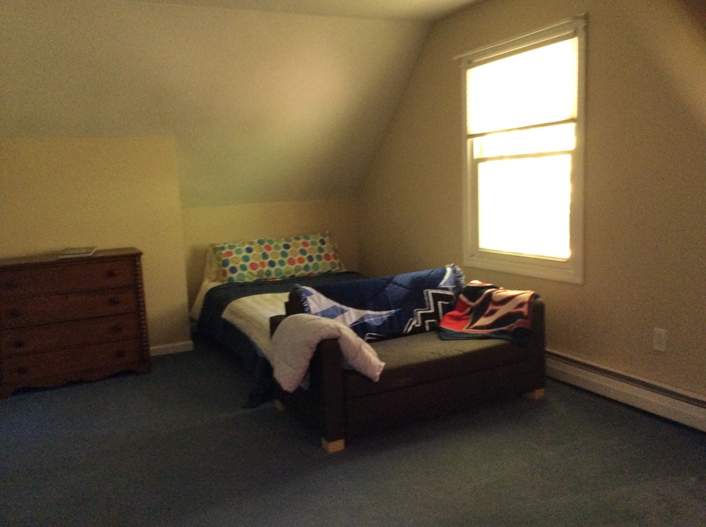 46 Old Village Road Sturbridge, MA 01566 - Photo 13 of 18 a bed sitting in a bedroom next to a window