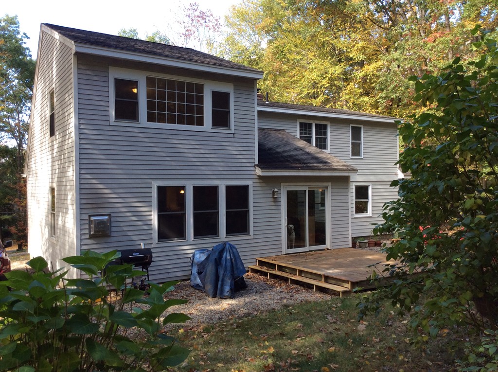 46 Old Village Road Sturbridge, MA 01566 - Photo 4 of 18 a view of a house with wooden fence and a large tree