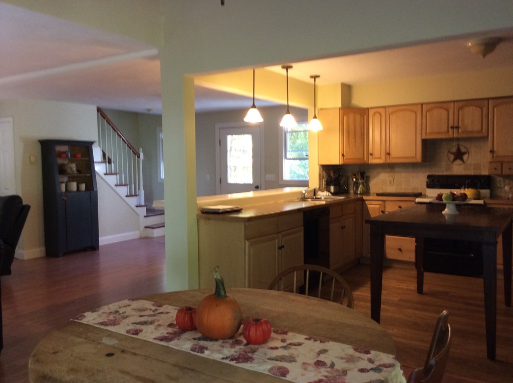46 Old Village Road Sturbridge, MA 01566 - Photo 8 of 18 a kitchen with a sink cabinets and wooden floor