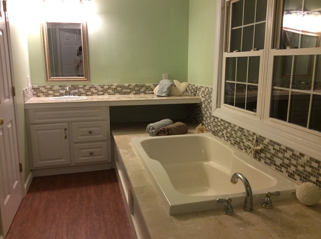 46 Old Village Road Sturbridge, MA 01566 - Photo 10 of 18 a bathroom with a tub sink and a mirror