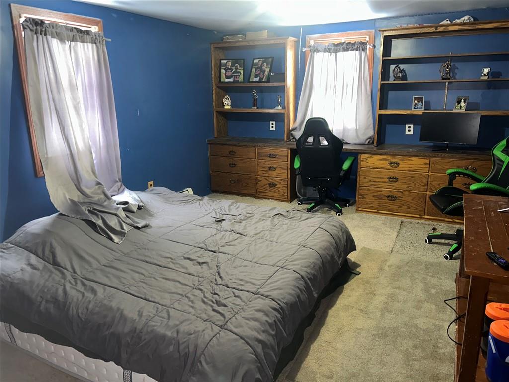 1300 Townline Road Mayport, PA 16240 - Photo 16 of 32 a bed sitting in a bedroom next to a window