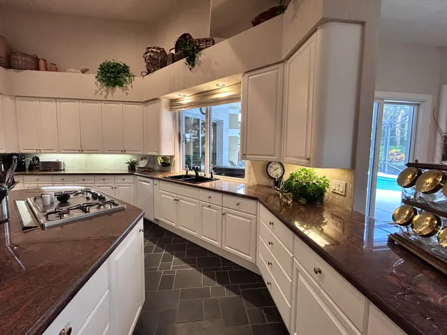 a living room with furniture fireplace and a large window