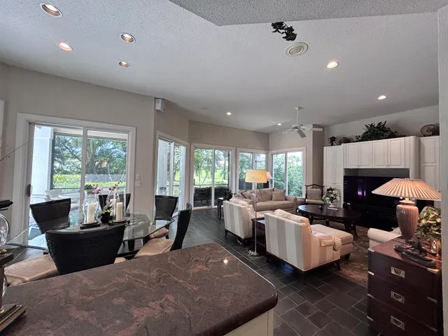 a view of a swimming pool with a yard