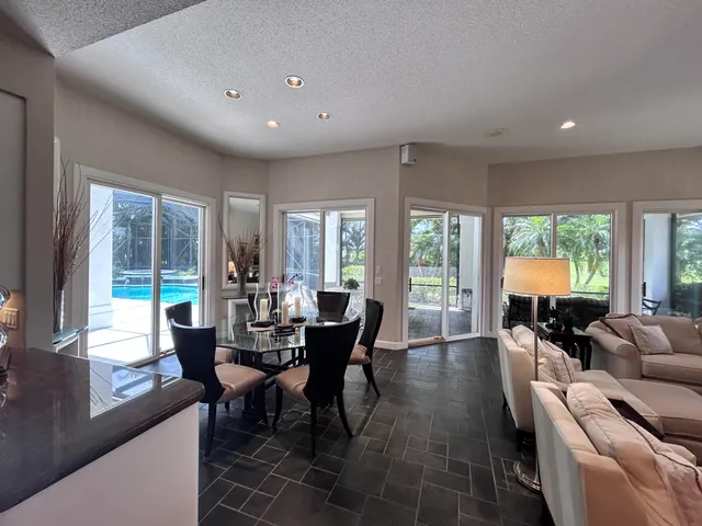 a spacious bathroom with a double vanity sink a large mirror and a bathtub