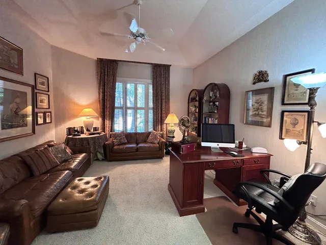 a bedroom with a bed couch and window