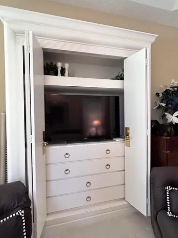 a view of a balcony with furniture