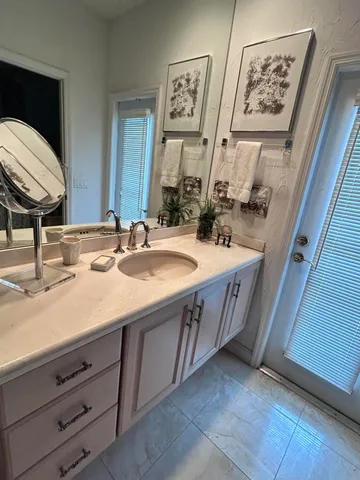 a bedroom with two beds and a window