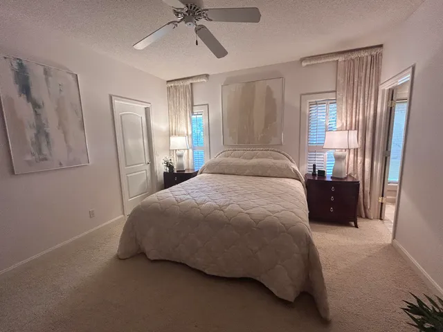 a bathroom with a granite countertop toilet sink and shower