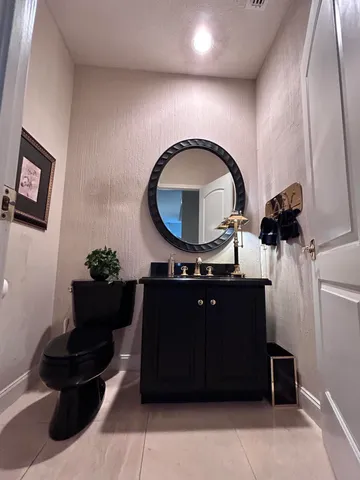a kitchen with stainless steel appliances a refrigerator sink and cabinets