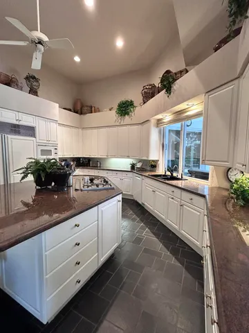 a kitchen with a dining table and chairs