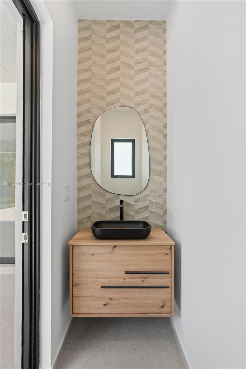 6221 Southwest 60th Street South Miami, FL 33143 - Photo 39 of 42 a bathroom with a sink and a mirror